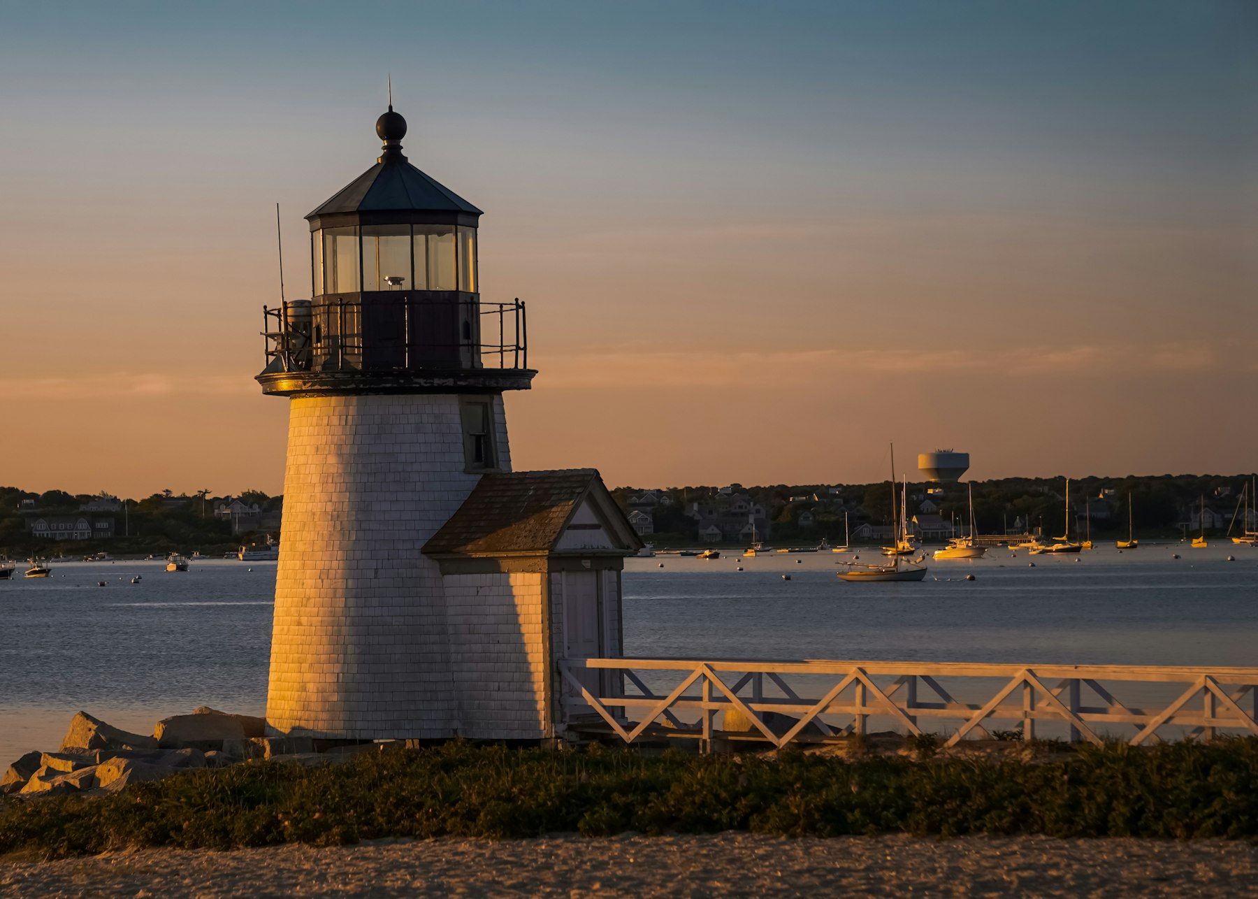 Brant Point Lighthouse at the entrance to Nantucket Harbor at dusk