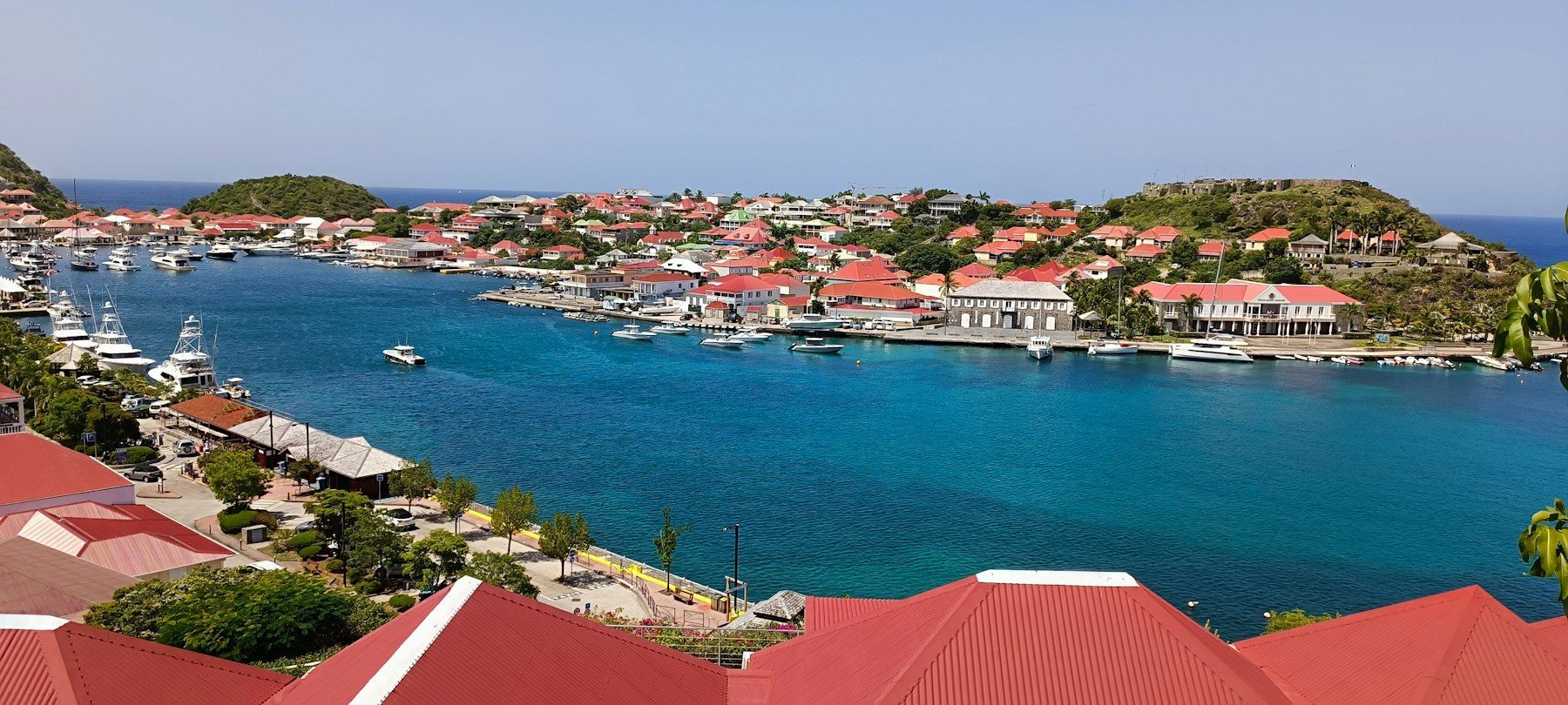 Gustavia harbor on St. Barths, with red roofs and yachts at anchor